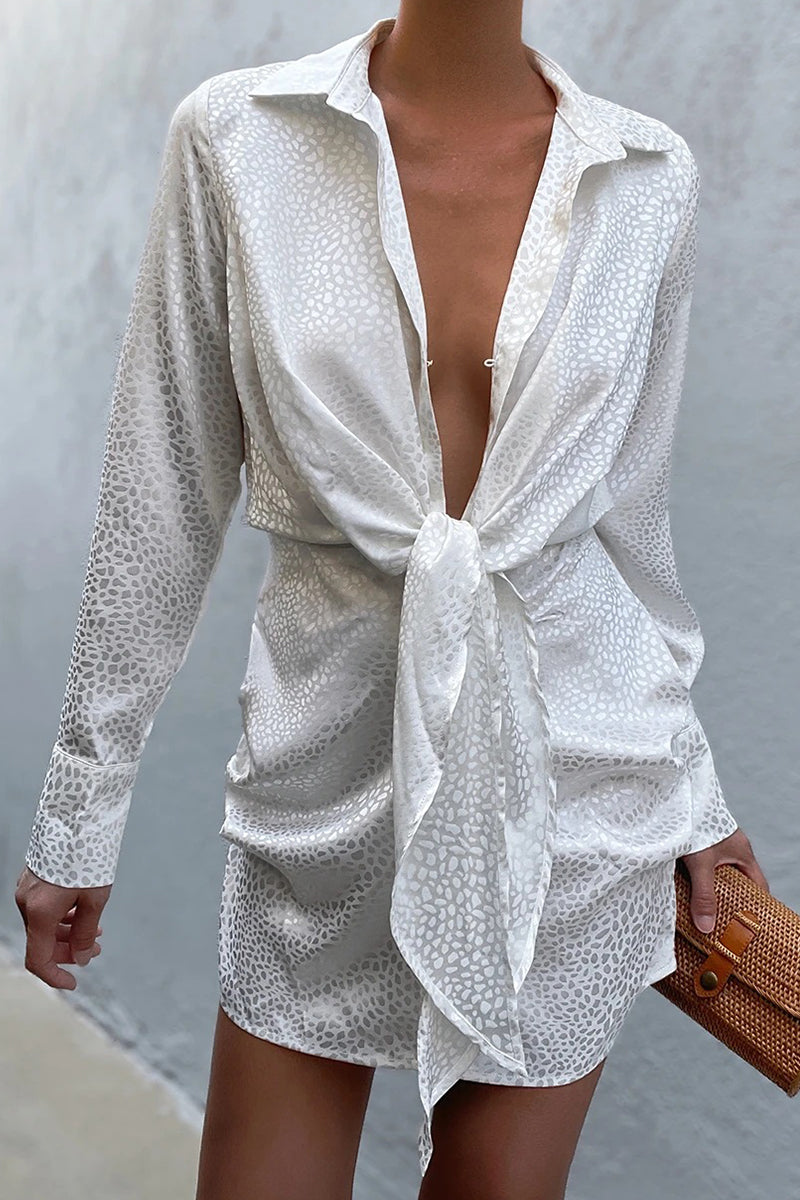 Minimalist Anna Leopard Mini Dress with a Turtleneck and Deep V Neckline Designer Edit