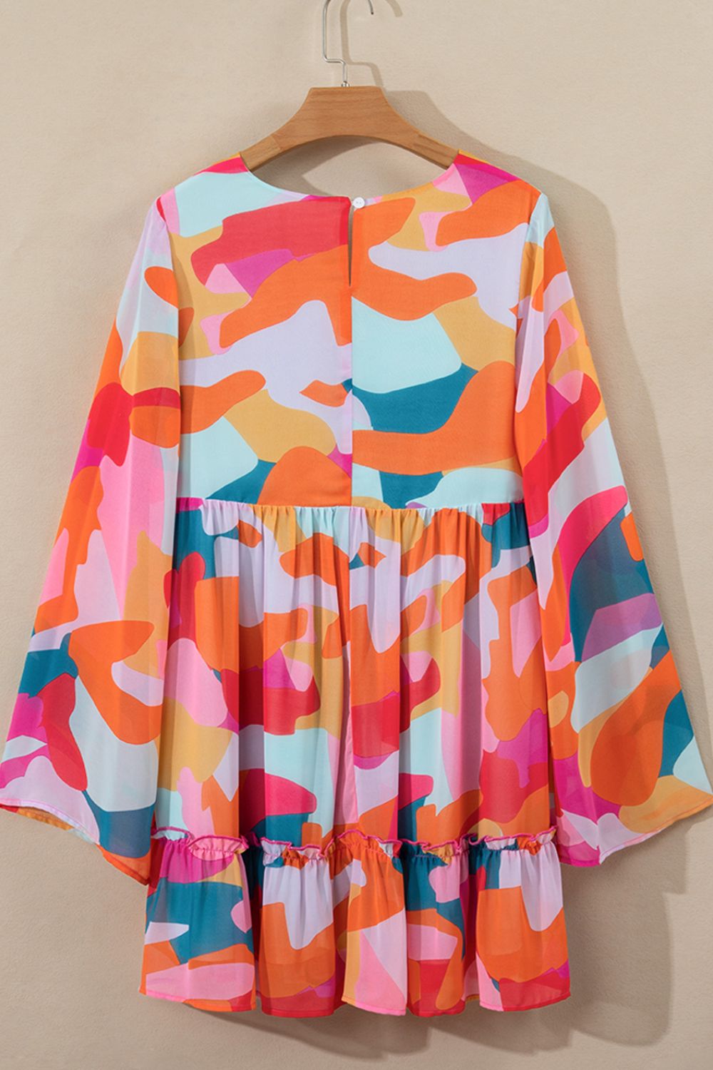 Effortless Laura Long Sleeve Mini Dress with Ruffle Hem and Color Block V Neck Statement Occasion Edit